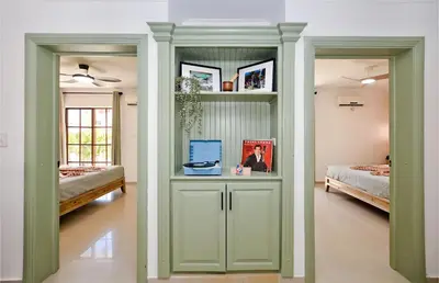 a room with two beds and a room with a bedroom at Tropical Retreat in El Cortecito beach condo in Punta Cana