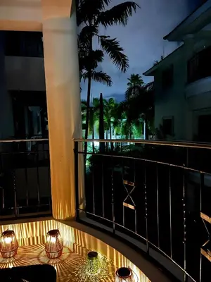 a balcony with a table with candles on it at Tropical Retreat in El Cortecito beach condo in Punta Cana