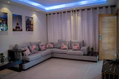 a living room with a couch with pillows at Luxury Apartment in San Pedro de Macorís