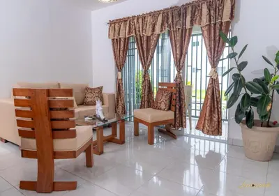 a living room with a couch and chairs and a window at Next to Basilica 3BR terrace wifi Punta Cana 30min in Higuey