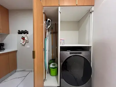 a kitchen with a washing machine in a kitchen at Santana Building in San Pedro de Macorís