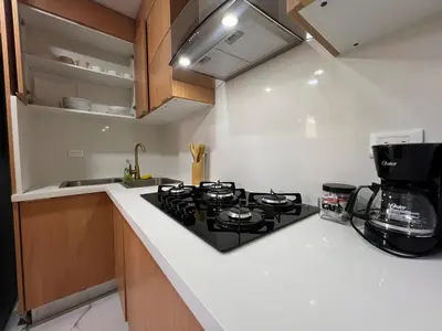 a kitchen with a stove and a counter top at Santana Building in San Pedro de Macorís