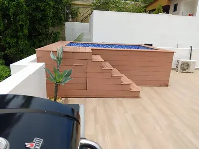 a patio with a table with a plant in it at Casahermosa in Santo Domingo