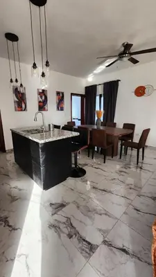 a living room with a sink and a table at Villa in SOV, close to Santa Fe in Sosúa