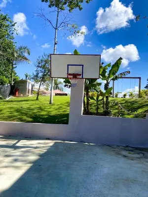 a basketball hoop on a wall in a yard at Colina Buena Vista VIP in Jarabacoa