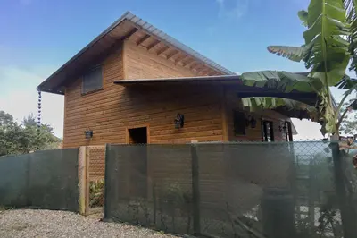 a wooden house with a fence in front of it at Casa Loma, Descansar en la Montaña, 30min STG in La Búcara