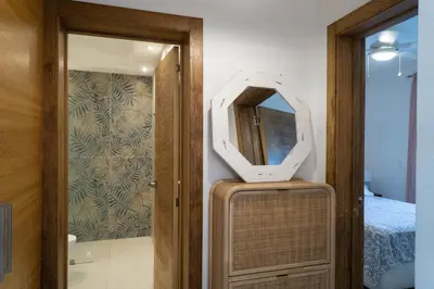 a mirror on top of a suitcase in a room at Residencial Esprit Caribbean in Bayahibe