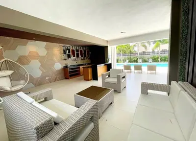 a living room with a couch and a table and chairs at Luxury Apartment-Santiago- PRIVATE Jacuzzi & Patio-Near Airport in Santiago de los Caballeros