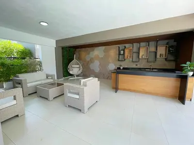 a living room with chairs and a table and a mirror at Luxury Apartment-Santiago- PRIVATE Jacuzzi & Patio-Near Airport in Santiago de los Caballeros