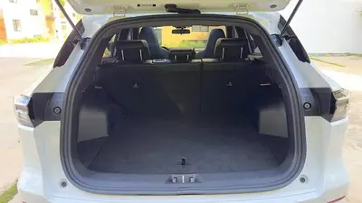 an open trunk of a white car with the back door open at Luxury Apartment- PRIVATE Patio & BBQ- Near Airport in Santiago de los Caballeros
