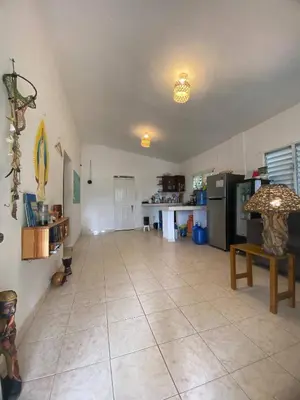 a large room with a tile floor and a kitchen at Bed-Breakfast lunch Tropical Private-room in Santa Bárbara de Samaná