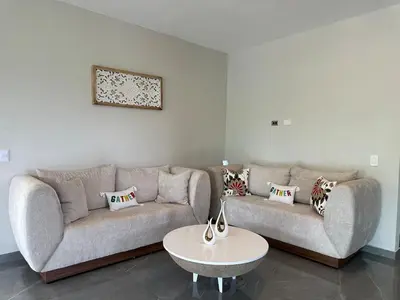 a living room with two couches and a table at Casa Finca El Encanto - 8 pax, A Minutos de la Playa in Arroyo El Cabo