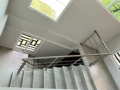 a spiral staircase in a building with windows at Casa Finca El Encanto - 8 pax, A Minutos de la Playa in Arroyo El Cabo