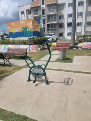 a sculpture of a bench in a park at Palma Real Apt Near Cibao Airport & Pool in Santiago de los Caballeros