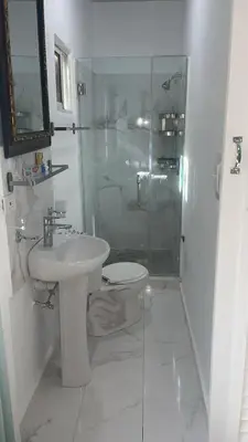 a bathroom with a toilet and a sink and a shower at Bargain Beach Getaway in Las Terrenas