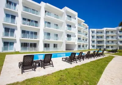 a row of chairs in front of a large building at Laguna del Sol in Sosúa