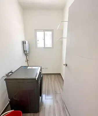 a small room with a television and a door at Condominio privado con piscina, cerca de la playa in Punta Cana