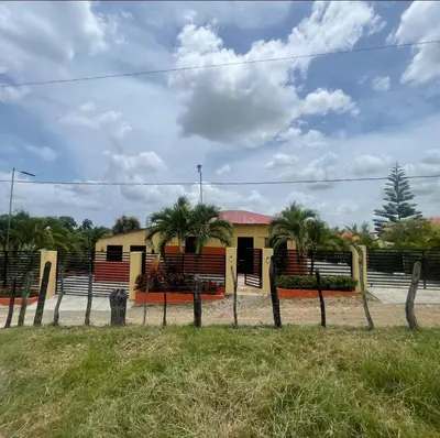 a house with a fence in front of it at Rancho La Loma in Higuey