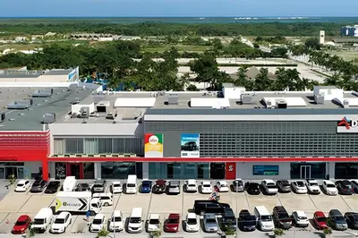 an aerial view of a parking lot with a dealership at Condominio con piscina, cerca de la playa in Punta Cana