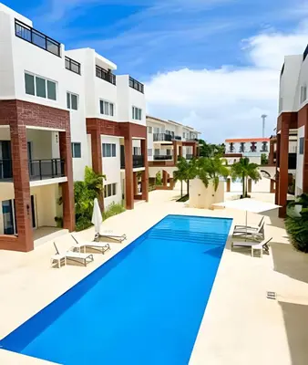 an image of an apartment complex with a swimming pool at Coral Village II in Punta Cana