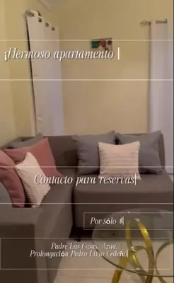 a reflection of a couch with pillows in a mirror at Kass Luxe in Colorado