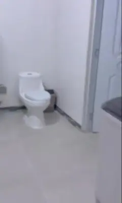 a bathroom with a white toilet in a room at Kass Luxe in Colorado