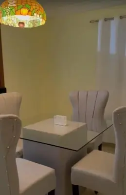 a table and two chairs with a table and a light at Kass Luxe in Colorado