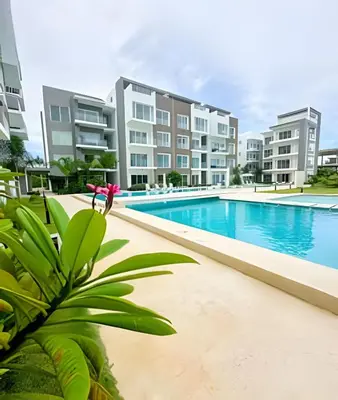an image of an apartment complex with a swimming pool at Alojamientos en Coral Bay II Cerca del Hard Rock Hotel Punta Cana in Punta Cana