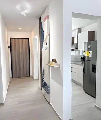 a kitchen with white walls and a refrigerator at Alojamientos en Coral Bay II Cerca del Hard Rock Hotel Punta Cana in Punta Cana