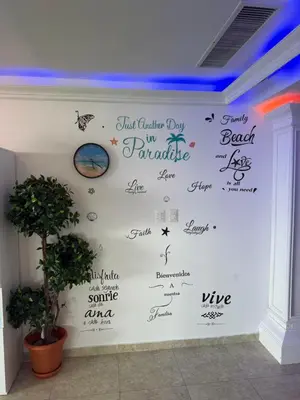 a wall with writing on it in a room at Beachfront Three Bedroom apt with Jacuzzi in Juan Pedro