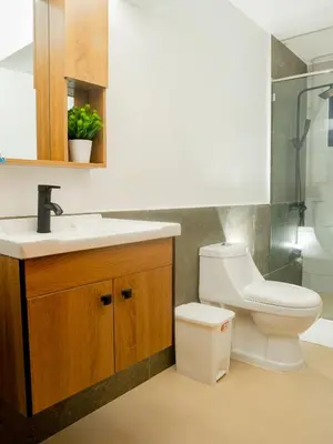 a bathroom with a toilet and a sink and a shower at Ocean Winds Hotel in San Felipe de Puerto Plata
