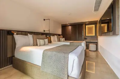 a large bedroom with two beds in it at Family Selection at Grand Palladium Select Bávaro - All Inclusive in Punta Cana