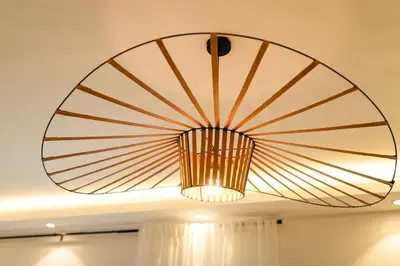 a large chandelier hanging from a ceiling at Views, pool and gym, 2 BR family friendly in Santiago de los Caballeros