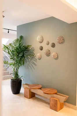 a room with two toilets and a plant on a wall at Views, pool and gym, 2 BR family friendly in Santiago de los Caballeros