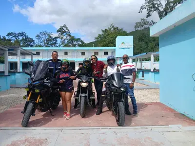 a group of people posing for a picture with their motorcycles at Paraíso Vacacional FERNANDO in Polo