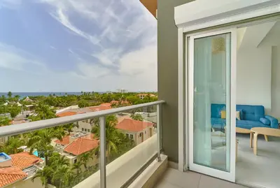 a balcony with a view of the city at Juan Dolio RD Beach Retreat in Juan Dolio