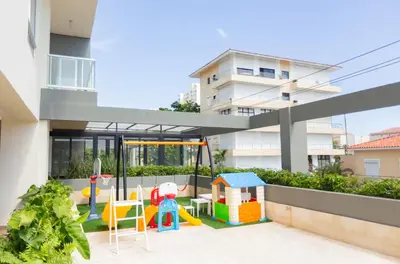 a play area with a playground in a building at Juan Dolio RD Beach Retreat in Juan Dolio