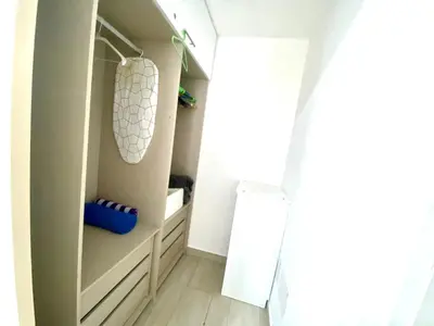 a room with a closet with a sink and a mirror at Los corales 1Bedroom Apartament Close to the Beach Central los corales RD in Punta Cana