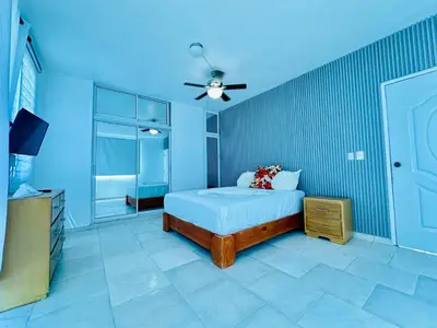 a bedroom with a bed and a ceiling fan at Apartartamento cabarete in Cabarete