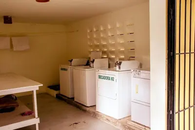 a laundry room with washers and dryers in it at nNomad Apartment steps to Sirena - Apartment in Sosúa