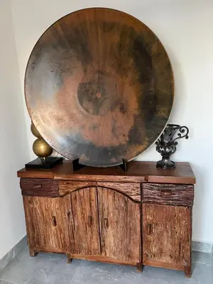 a large wooden plate on top of a wooden dresser at Villa con Piscina en la Romana in La Romana