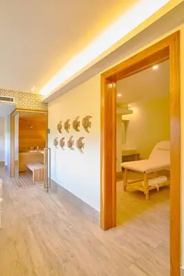 a room with a bed and a table in a room at Luxurious Caribbean Aquarella 10th in La Puntica de Juan Dolio