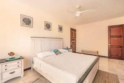a bedroom with a bed and a ceiling fan at Apartment with 2bedrooms in Portillo Residences in Las Terrenas