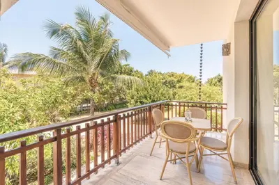 a patio with a table and chairs on a balcony at Apartment with 2bedrooms in Portillo Residences in Las Terrenas