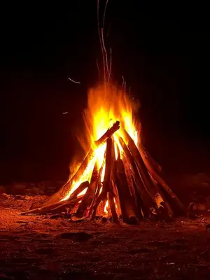 a large fire in the desert at night at Ki-Ra Holistic Living in Boca de Chavón