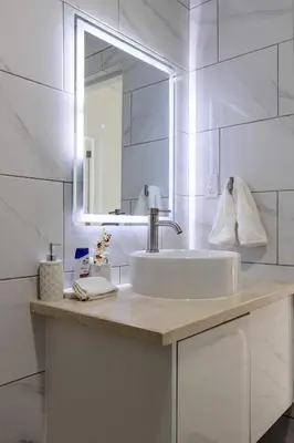a white bathroom with a sink and a mirror at PERLA I -Modern Private Villa - 4 Bedrooms with Pool in Sosúa