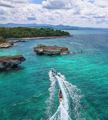 a boat in the water in the ocean at Lujosa Villa in Río San Juan J in Río San Juan
