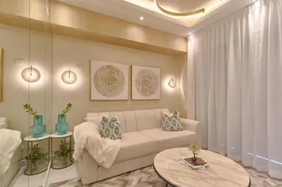 a living room with a couch and a table at Aquarella Caribbean Paradise Playa Juan Dolio in La Puntica de Juan Dolio