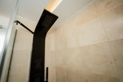 a shower in a bathroom with a shower head at Apartamento moderno en Cana Rock - Punta Cana in Punta Cana