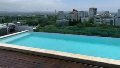 a large blue swimming pool on top of a building at Soja 11 in Santiago de los Caballeros